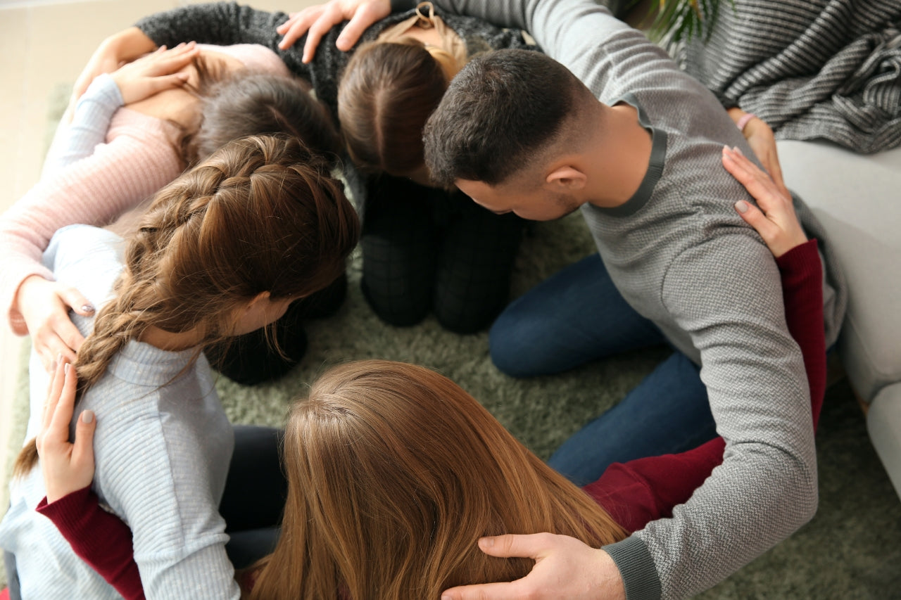 group of people praying